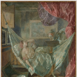 Young woman asleep on a hammock