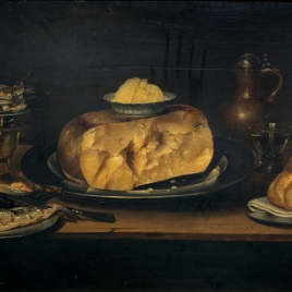 Bodegón: mesa con vajilla, queso, salchichón y pescados