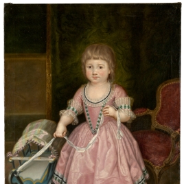 La infanta María Isabel de Borbón, niña, con carrito de juguete